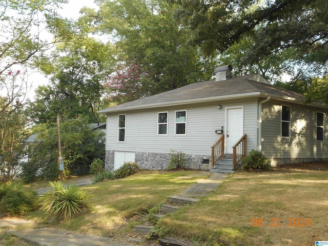 view of front of home with a front yard