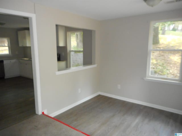 unfurnished room with ceiling fan and dark hardwood / wood-style floors