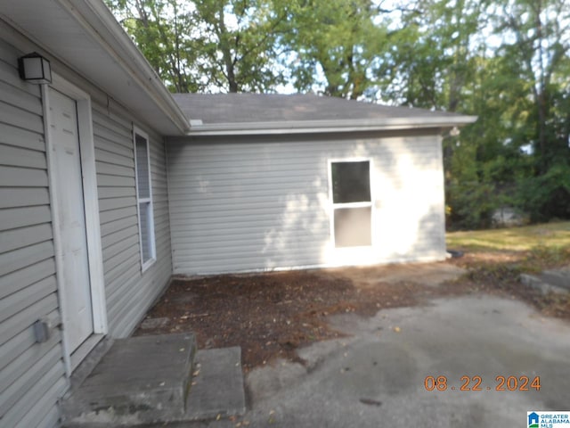 view of side of home with a patio