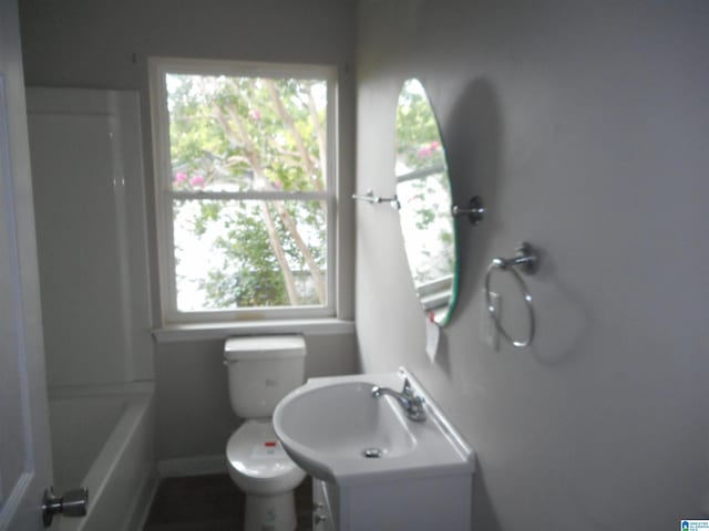 bathroom with toilet and plus walk in shower