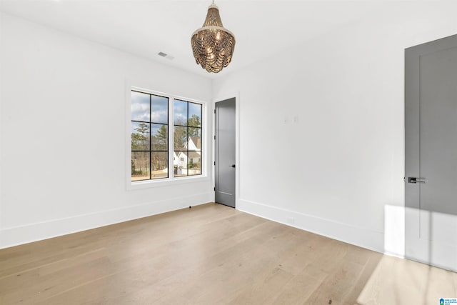 unfurnished room with light hardwood / wood-style flooring