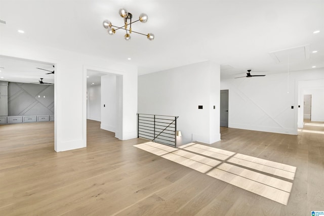 unfurnished living room featuring light hardwood / wood-style flooring and ceiling fan