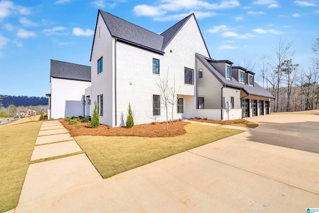 view of property exterior featuring a yard