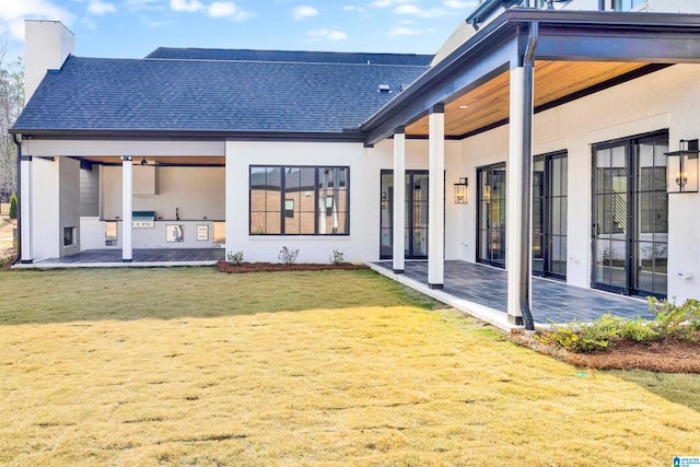 exterior space with a lawn and a patio