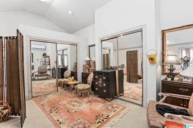 carpeted bedroom with two closets, a wall mounted AC, and lofted ceiling