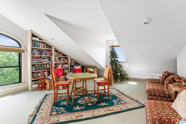 rec room with carpet floors and lofted ceiling