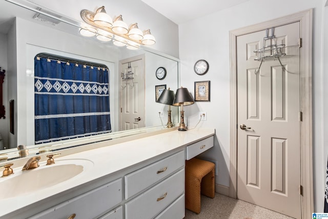 bathroom with a shower with curtain and vanity