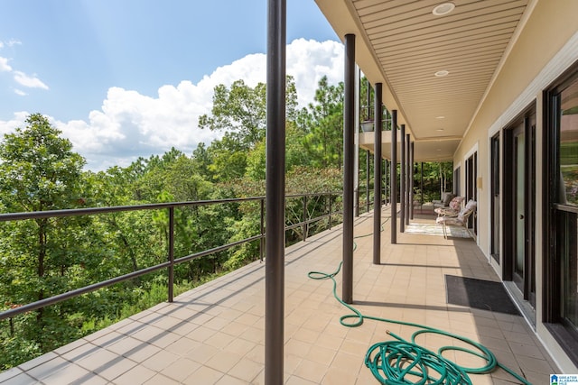 view of patio featuring a balcony