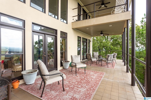 view of patio / terrace with a balcony and ceiling fan