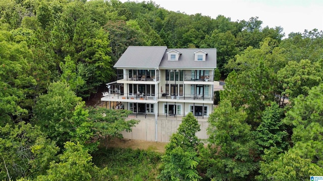 rear view of house featuring a balcony