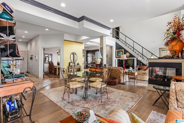 dining room with crown molding and wood-type flooring