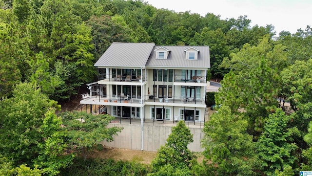 back of property with a balcony