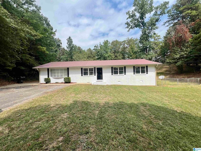 ranch-style house with a front lawn