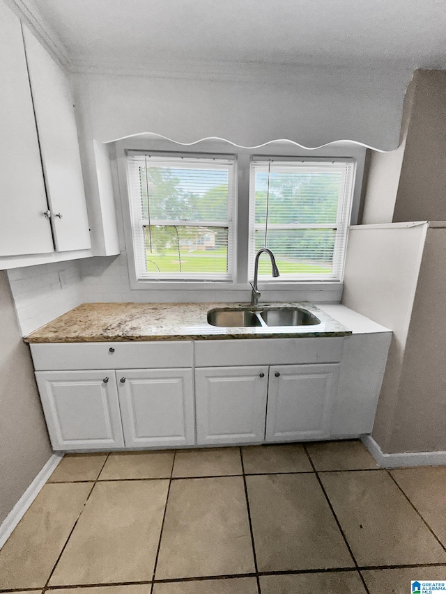 interior space featuring tile patterned flooring and sink