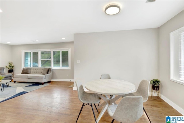 dining space featuring light wood-type flooring