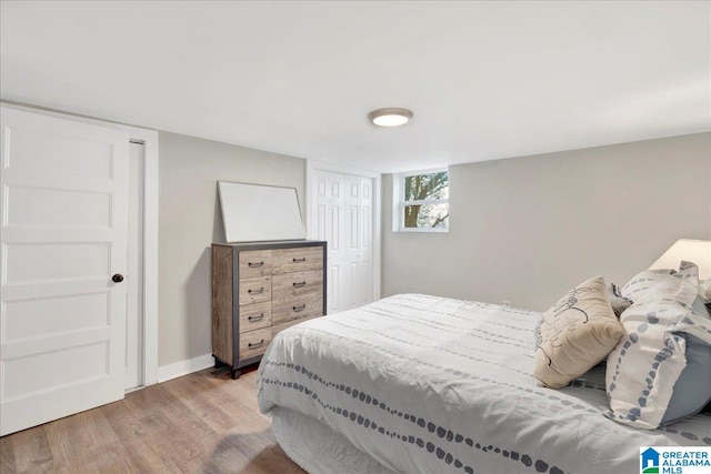 bedroom with light hardwood / wood-style flooring