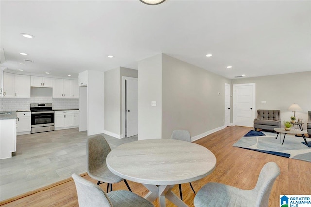 dining area with light hardwood / wood-style flooring