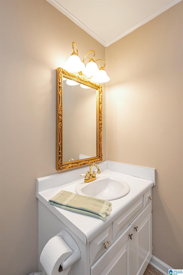 bathroom featuring ornamental molding and vanity