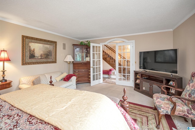 bedroom featuring french doors, light colored carpet, ornamental molding, and a textured ceiling