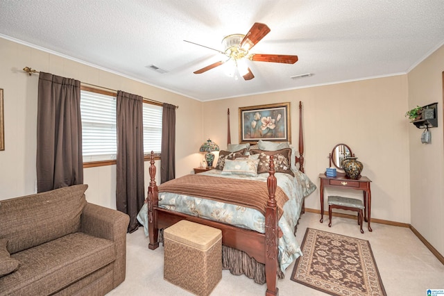 bedroom with ceiling fan, crown molding, and light carpet