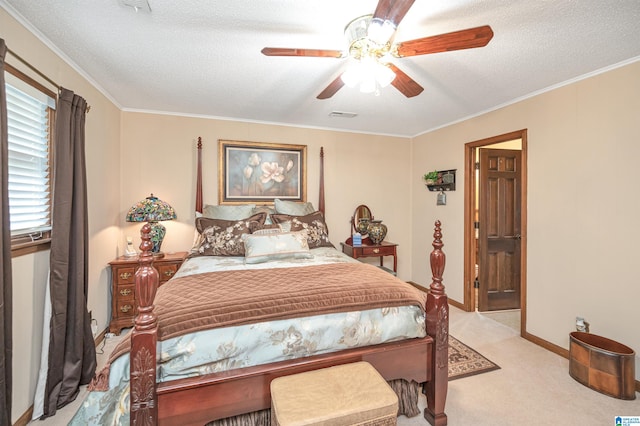 bedroom with ceiling fan, crown molding, light carpet, and a textured ceiling