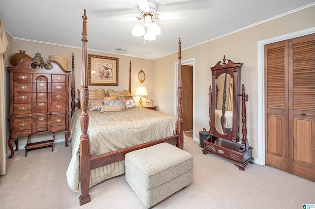 bedroom with a closet, ceiling fan, light colored carpet, and crown molding