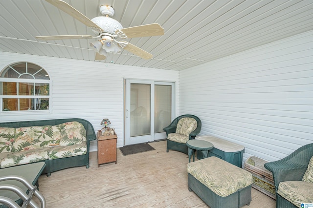 sunroom / solarium with ceiling fan and wooden ceiling