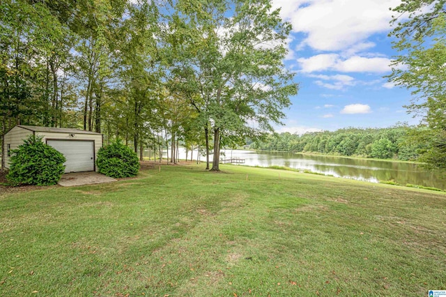 view of yard featuring an outdoor structure and a water view