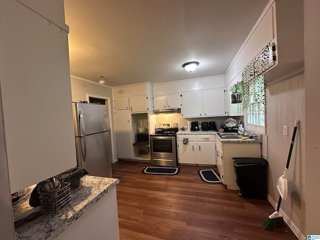 kitchen with crown molding, appliances with stainless steel finishes, dark hardwood / wood-style flooring, and white cabinetry