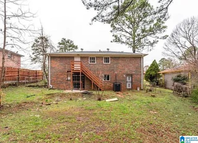 rear view of house with a lawn