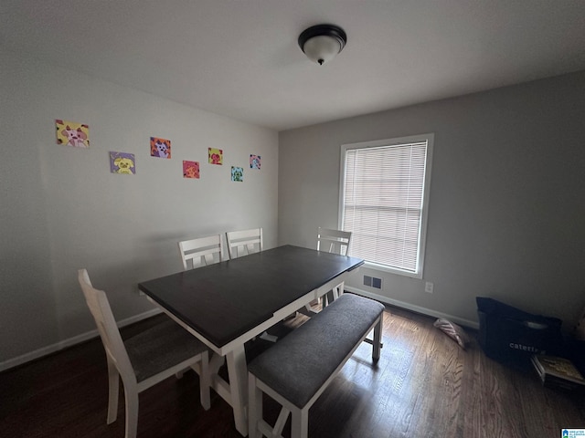 dining space featuring dark hardwood / wood-style flooring