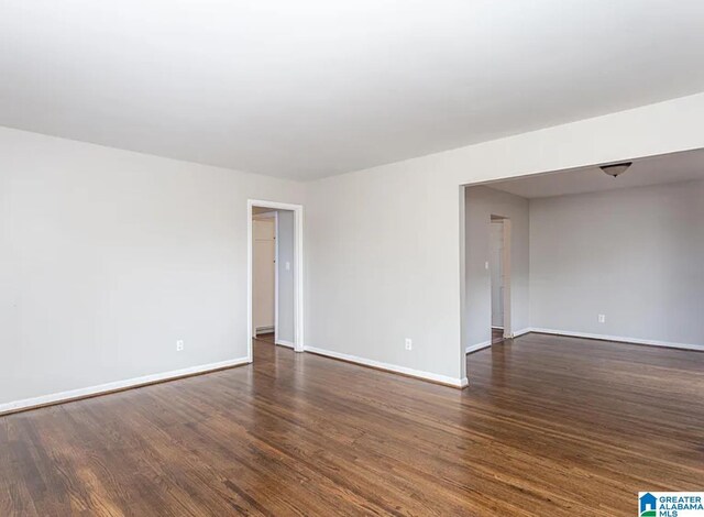 spare room featuring dark hardwood / wood-style flooring