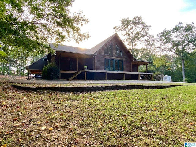 rear view of house with a lawn