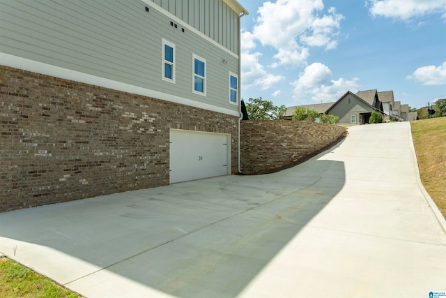 view of property exterior featuring a garage