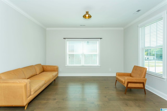 living area with dark hardwood / wood-style floors and ornamental molding