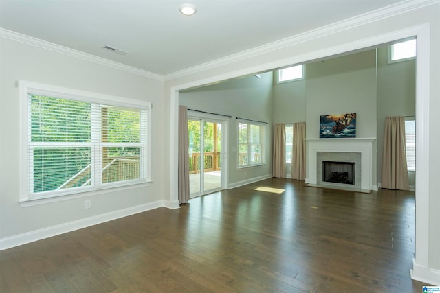 unfurnished living room with a fireplace, dark hardwood / wood-style flooring, and crown molding