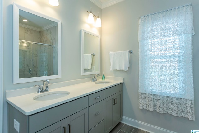 bathroom with vanity, ornamental molding, and an enclosed shower