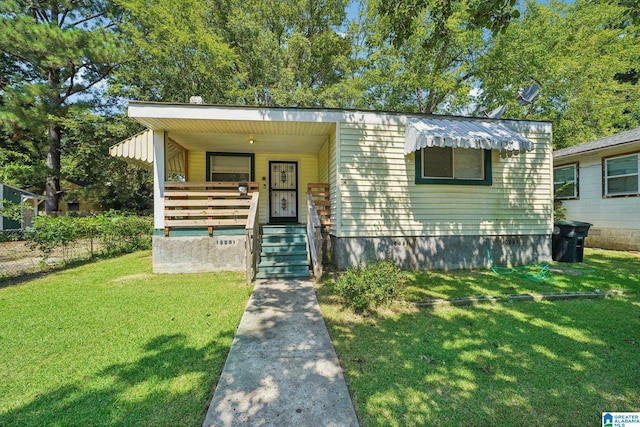 view of front of property with a front yard and a porch