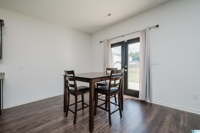 dining space with french doors and dark hardwood / wood-style flooring