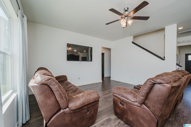 living room featuring wood-type flooring and ceiling fan