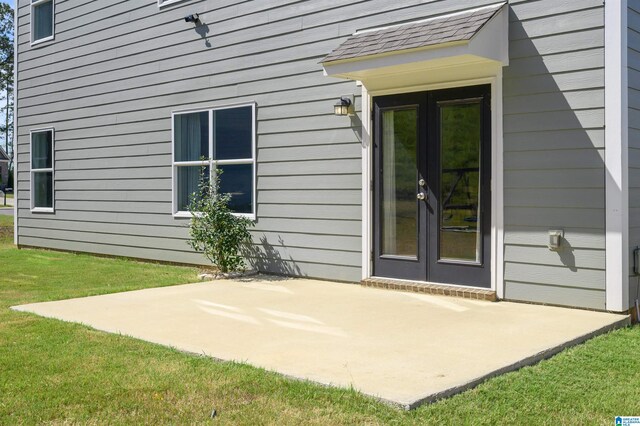 exterior space with french doors, a patio area, and a yard