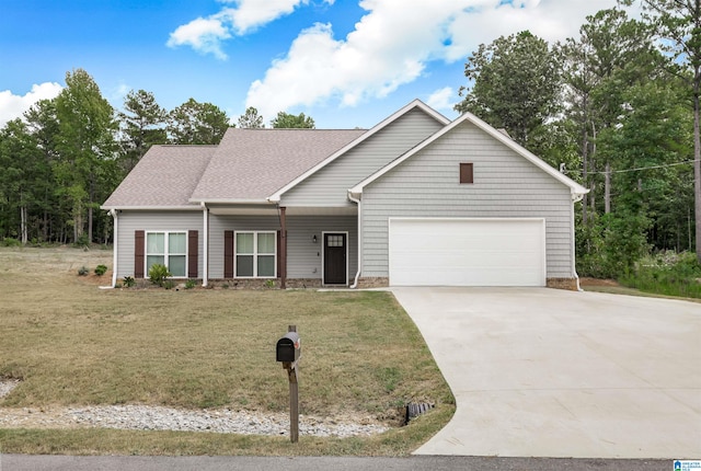 view of front of home featuring a front lawn and a garage