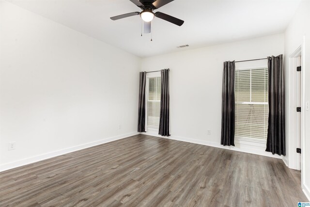 spare room with ceiling fan and hardwood / wood-style flooring