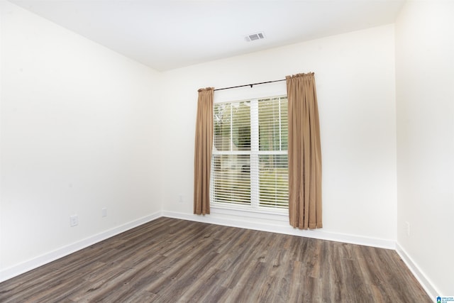 spare room featuring hardwood / wood-style flooring