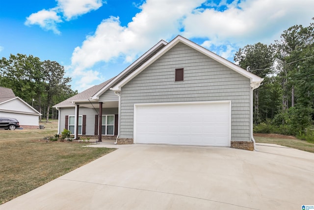 view of front of house featuring a garage and a front yard