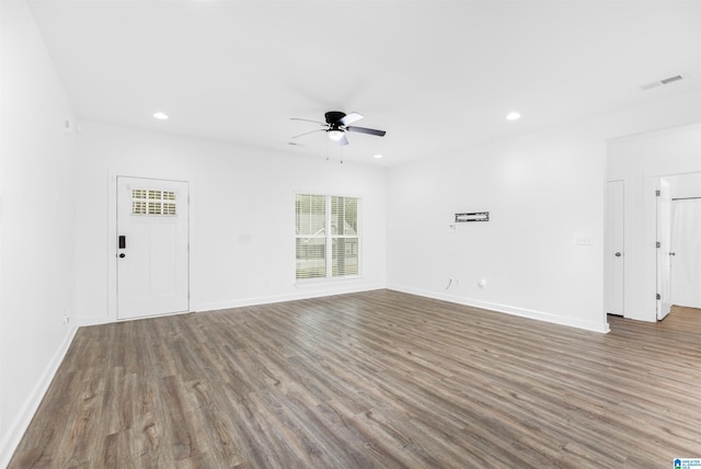 unfurnished living room featuring ceiling fan and hardwood / wood-style flooring