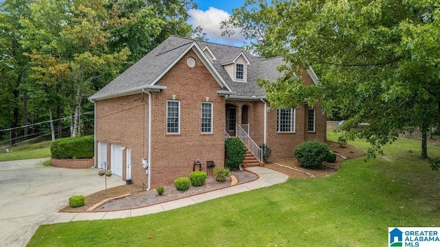 view of front of house featuring brick siding, a front yard, concrete driveway, and an attached garage