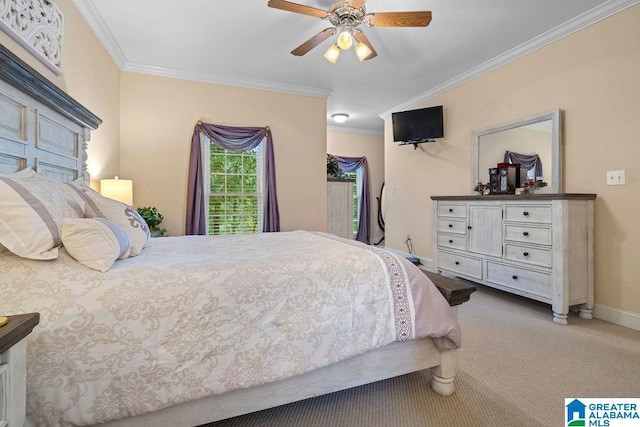 carpeted bedroom featuring a ceiling fan, ornamental molding, and baseboards