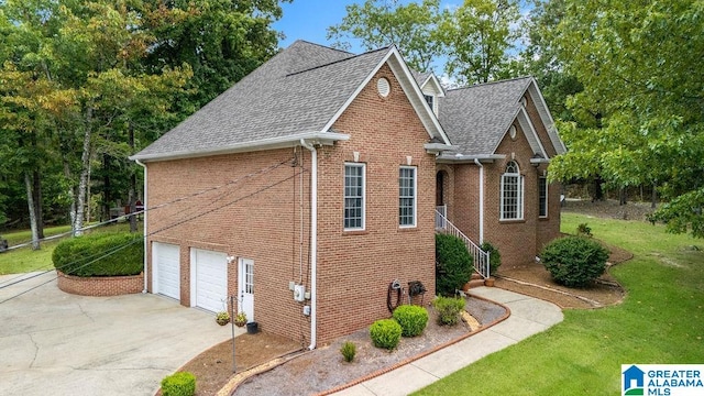 view of home's exterior with a garage and a yard