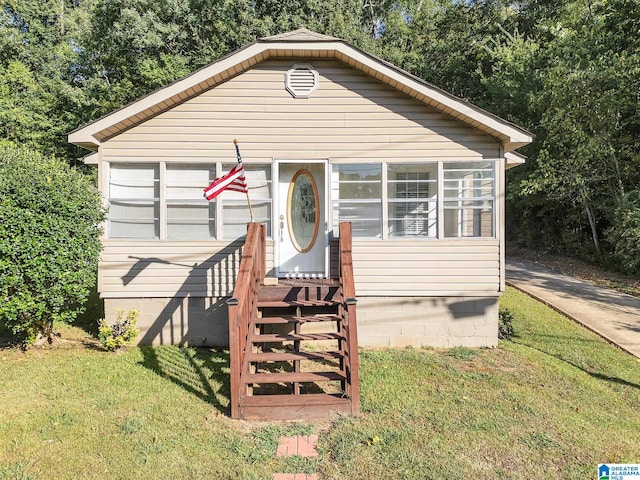 bungalow with a front yard